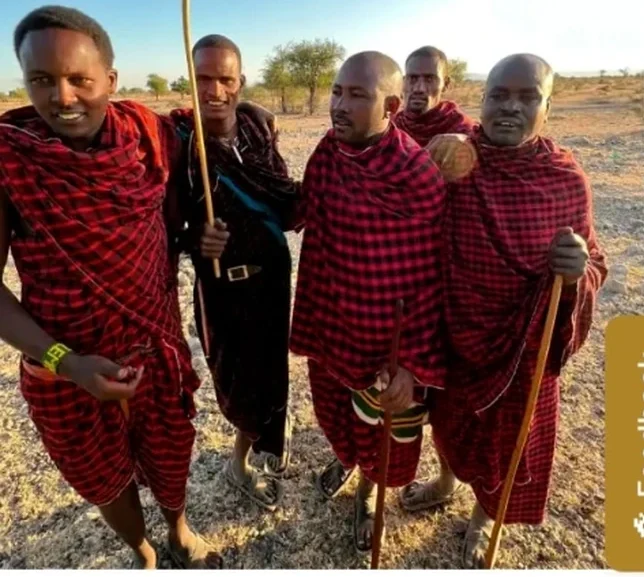 Lisa with a group of Maasai men in red shukas