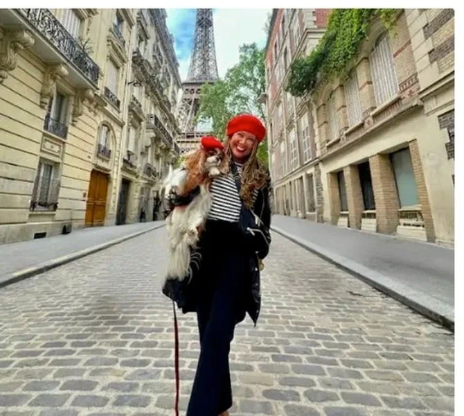 Lisa on a Paris street with the Eiffel Tower behind
