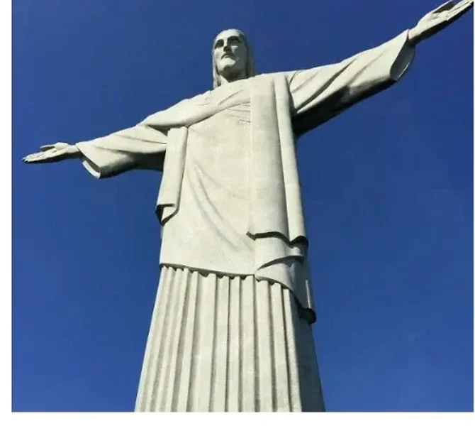 Christ the Redeemer against a deep blue sky